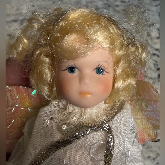 Porcelain Angel Doll with Golden Hair and Iridescent Wings - Picture 4 of 6